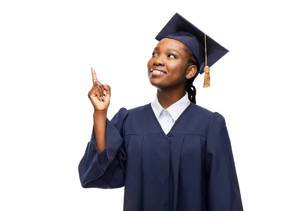 Happy female graduate student in mortarboard — Stock Photo, Image