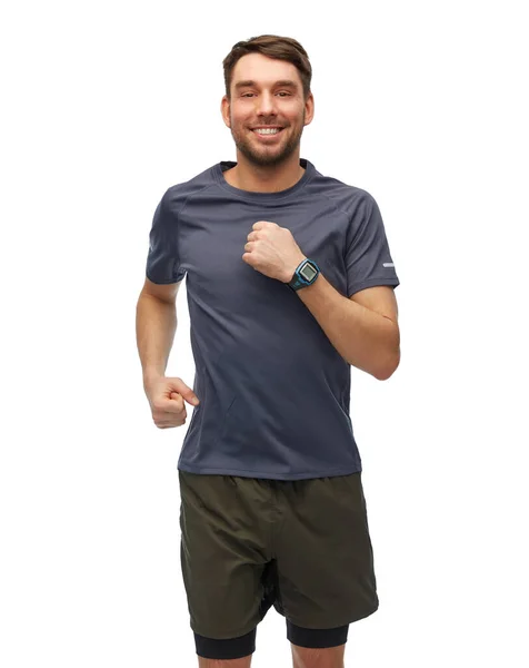 Sorrindo correndo homem em roupas esportivas — Fotografia de Stock