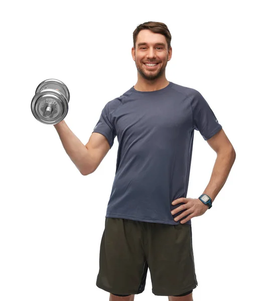 Feliz hombre sonriente haciendo ejercicio con pesas — Foto de Stock