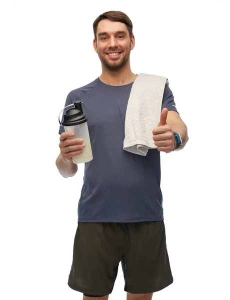 Man with protein shake bottle showing thumbs up — Stock Photo, Image