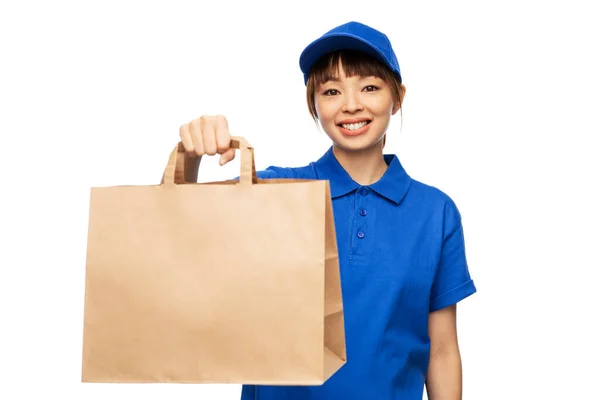 Delivery woman with takeaway food in paper bag — Stock Photo, Image