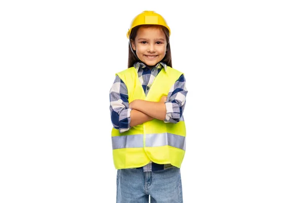 Sorridente bambina in casco e gilet di sicurezza — Foto Stock