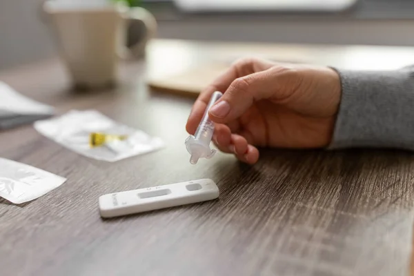 Woman making self testing coronavirus test at home — Fotografia de Stock