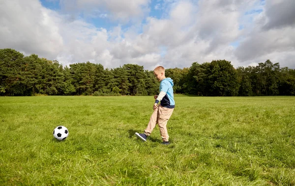 Happy little boy with ball playing soccer at park — Stock Photo, Image