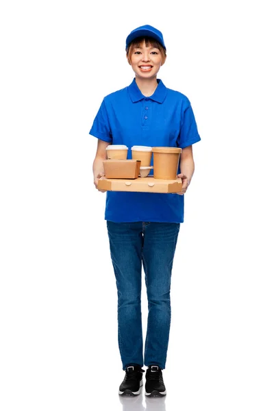 Delivery woman with takeaway food and drinks — Stock Photo, Image