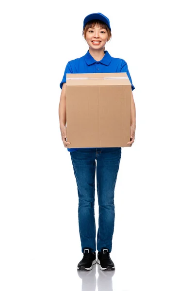 Delivery woman in blue uniform with parcel box — Stock Photo, Image