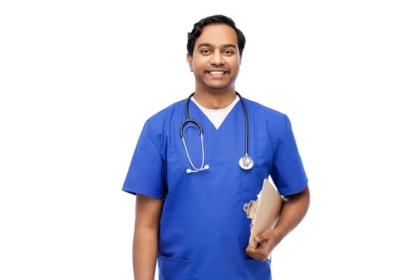 Indian male doctor with clipboard and stethoscope — Stock Photo, Image