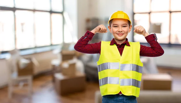 Boy in protective helmet showing power gesture — Stock Photo, Image