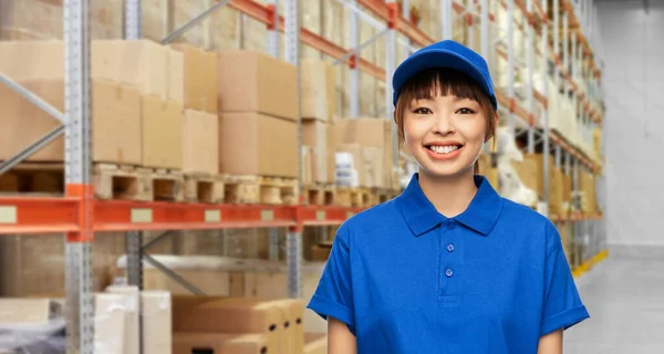 Happy smiling delivery woman in blue uniform — Stock Photo, Image