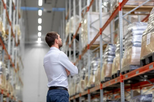 Businessman at warehouse — Stock Photo, Image