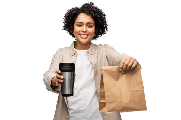 Happy woman with thermo cup, paper bag and shopper — Stock Photo, Image