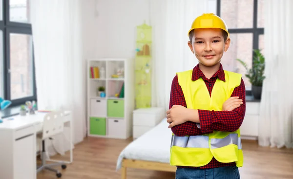 Little boy in protective helmet and safety vest — Stock Photo, Image