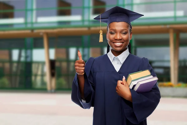 Feliz estudiante de posgrado con libros —  Fotos de Stock