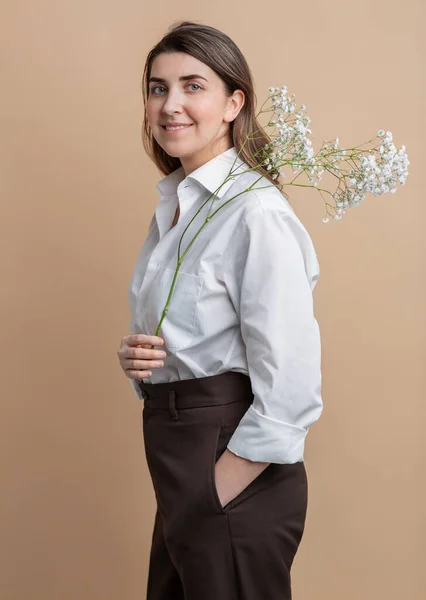 Portrait of happy woman holding branch of flower — Stock Photo, Image