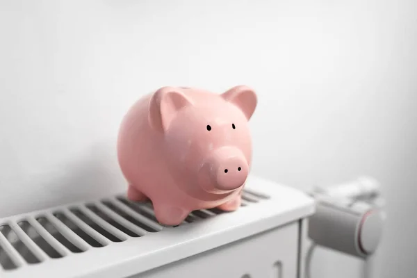 piggy bank on radiator at home