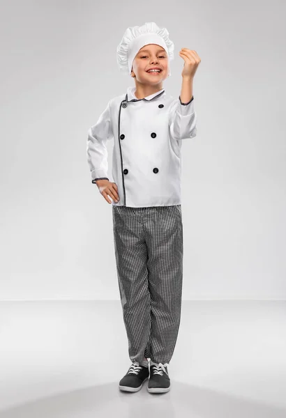 Niño sonriente en chefs toque y chaqueta — Foto de Stock