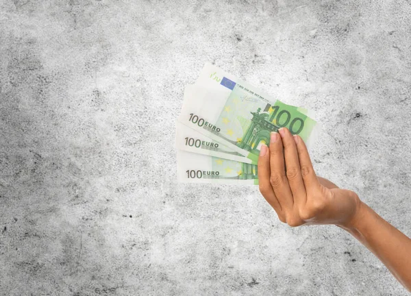 Close up of hand holding euro money — Fotografia de Stock