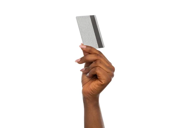 Close up of hand with silver credit card — Stock Photo, Image