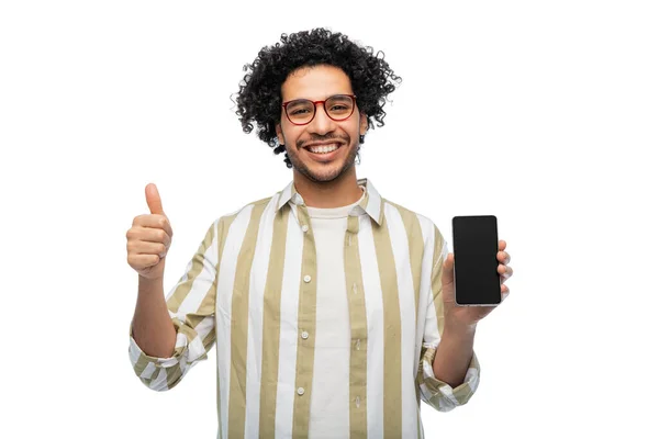 Man in glasses with smartphone showing thumbs up — Stockfoto
