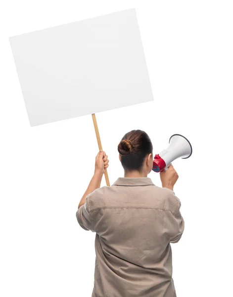 Woman with megaphone protesting on demonstration — Stockfoto