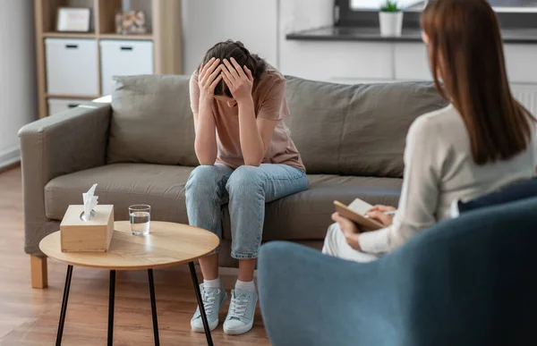 Woman and psychologist at psychotherapy session — Stock Fotó