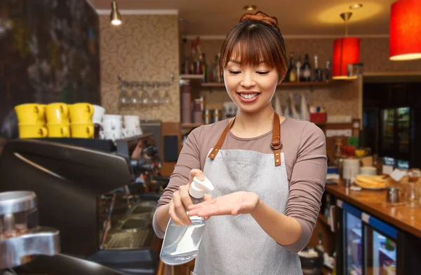 Barista with hand sanitizer or soap at restaurant — Stock Photo, Image