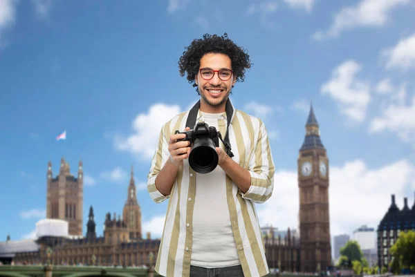 Smiling man or photographer with camera in london — Stock Photo, Image