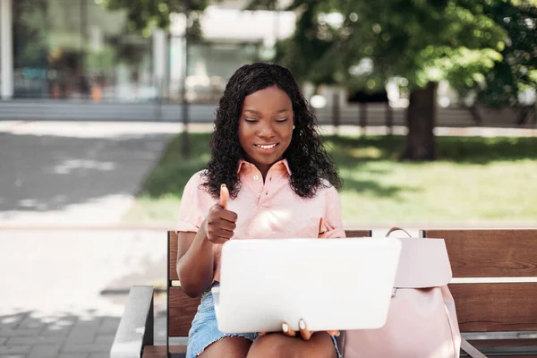 African student girl with laptop having video call — Stock Photo, Image