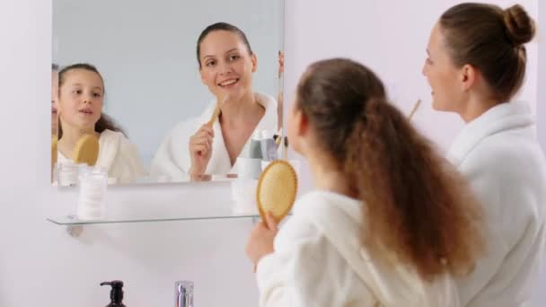 Beauty Hygiene People Concept Happy Smiling Mother Daughter Hairbrush Toothbrush — Stock Video © Syda_Productions #575317750