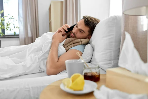 Health Illness People Concept Sick Man Calling Smartphone Bed Home — Stock Photo, Image