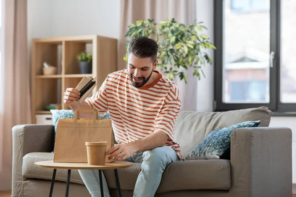 Consumption Eating People Concept Smiling Man Unpacking Takeaway Food Paper — Photo