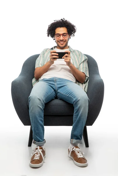 Technology People Furniture Concept Happy Smiling Young Man Glasses Smartphone — Fotografia de Stock