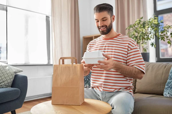 Consumption Eating People Concept Smiling Man Unpacking Takeaway Food Paper — Photo