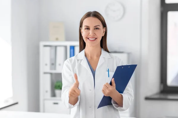Medicine Healthcare Profession Concept Smiling Female Doctor Clipboard Showing Thumbs — Fotografia de Stock