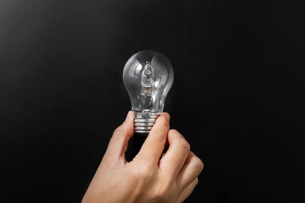 Electricity Energy Power Consumption Concept Close Hand Holding Lightbulb Black — Stockfoto
