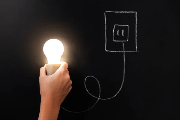 Electricity Energy Power Consumption Concept Close Hand Holding Burning Lightbulb — Stockfoto