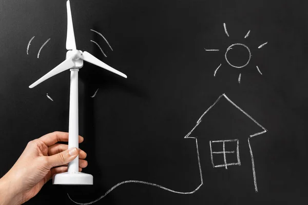 Energy Power Sustainability Concept Close Hand Holding Wind Turbine Model — Fotografia de Stock