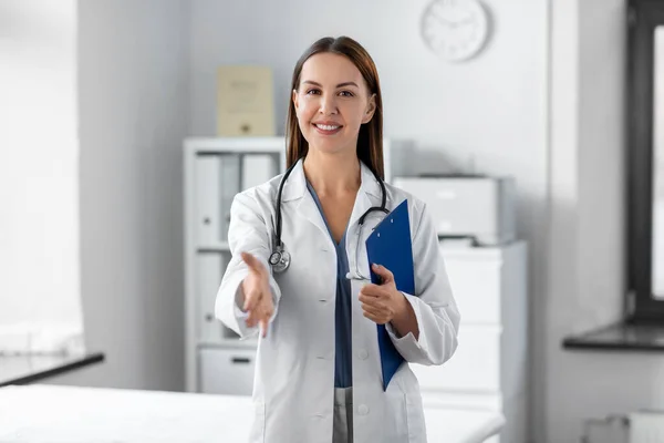 Medicine Healthcare Profession Concept Smiling Female Doctor Stethoscope Clipboard Giving — Stok fotoğraf