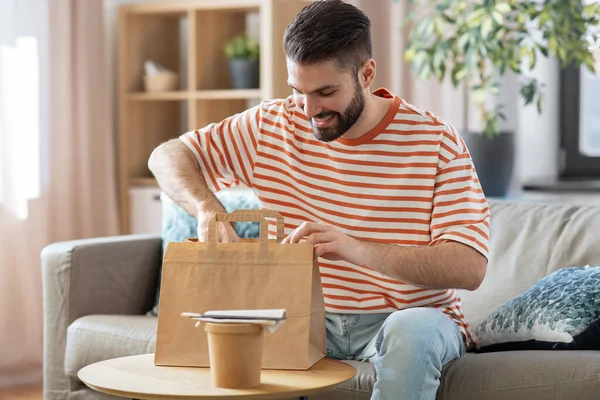 Consumption Eating People Concept Smiling Man Unpacking Takeaway Food Paper — Foto de Stock