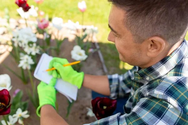 Gardening People Concept Close Man Writing Notebook Taking Care Flowers — Stockfoto