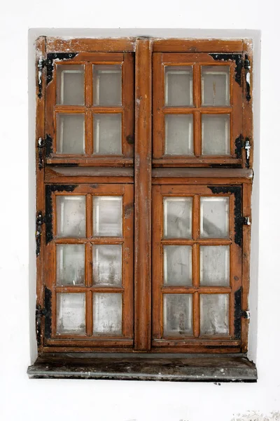 Old wooden window in the white wall — Stock Photo, Image