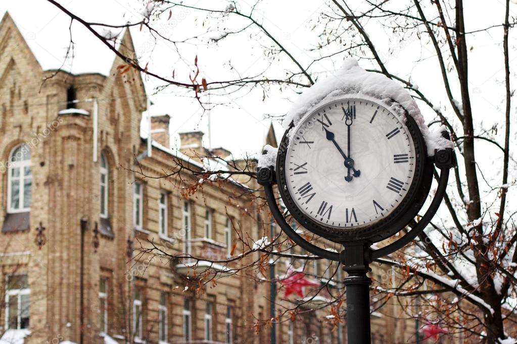Street clock in the snow