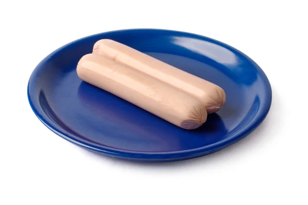 Две сосиски на голубой тарелке — стоковое фото