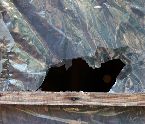 Black hole in the polyethylene timber-framed — Stock Photo, Image