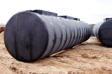Underground storage tank at a construction site. clipart