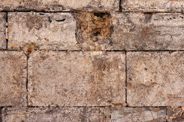 Textuur van een bruine stenen muur — Stockfoto