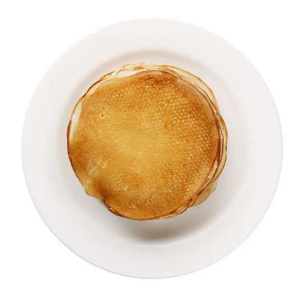 Yellow pancakes on white plate isolated — Stock Photo, Image