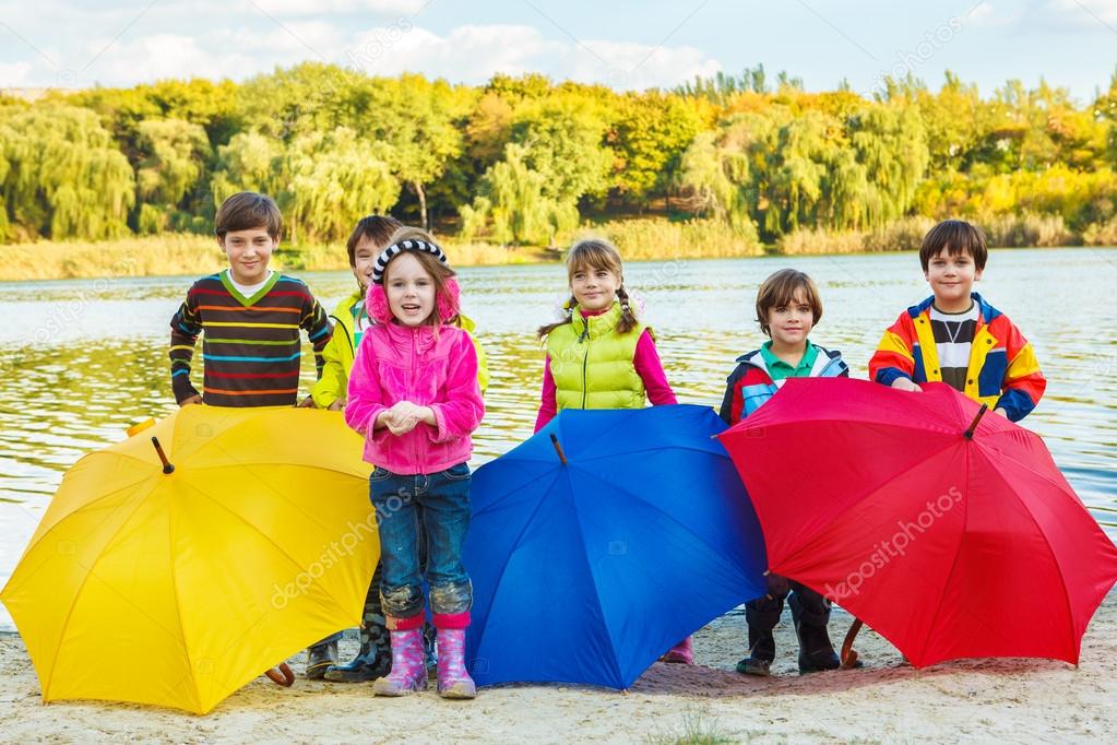 Kids with umbrellas