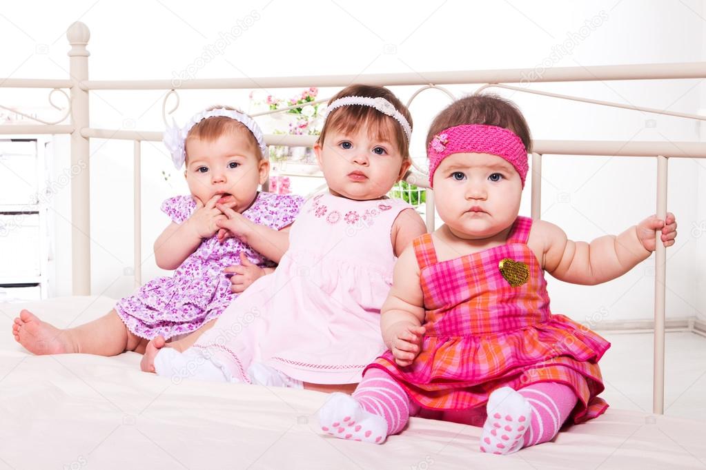 Baby girls in lovely dresses