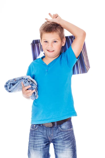 Jongen bedrijf jeans — Stockfoto